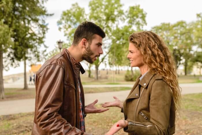 A man and a woman engaging in banter with each other